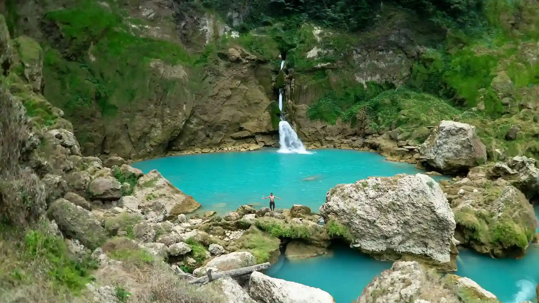 Matayangu Waterfall falling into a turquoise pool