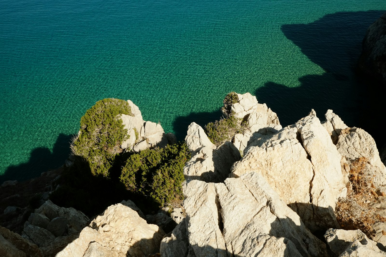 A large body of water surrounded by rocks
